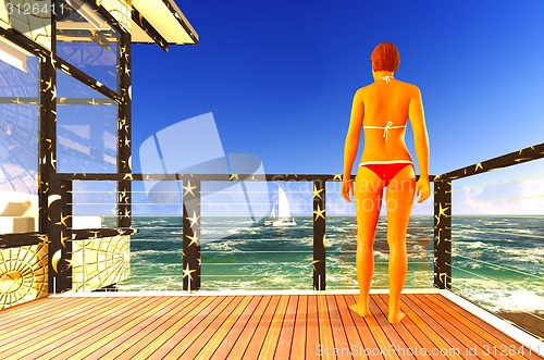 Image of Woman standing on patio