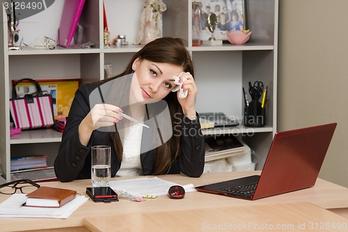 Image of Diseased girl at work a computer