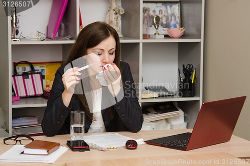 Image of Sick girl in the office