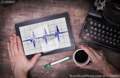 Image of Electrocardiogram on a tablet - Concept of healthcare