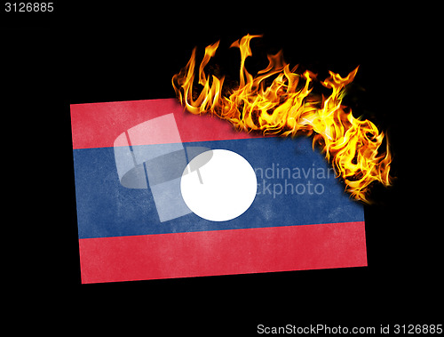 Image of Flag burning - Laos