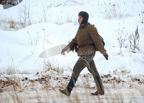Image of Woman soldier walking