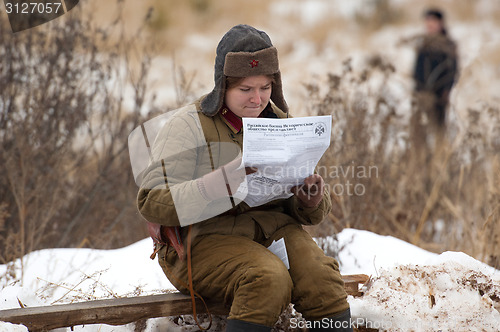 Image of Reading a newspaper