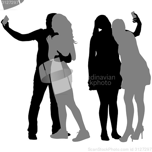 Image of Silhouettes  man and woman taking selfie with smartphone on whit