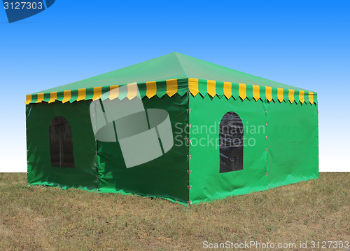 Image of Green very big  tent in the field