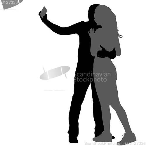 Image of Silhouettes  man and woman taking selfie with smartphone on whit