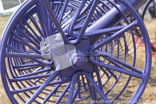 Image of tractor and seeder planting crops on a field