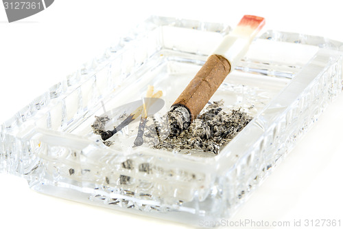 Image of Cigarette butt with red lipstick in the ashtray.