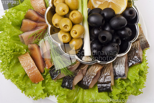 Image of A composition with smoked herring pieces