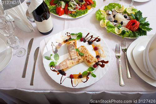 Image of celebratory table with tasty dishs