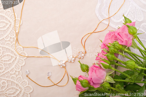 Image of Chain and roses on lace background