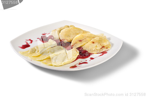 Image of Ukrainian national dish varenyky (ravioli) with cherry