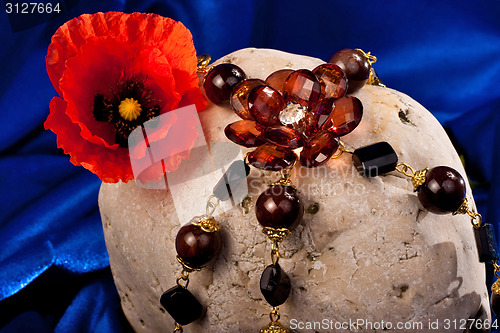 Image of Necklace, flower and stone