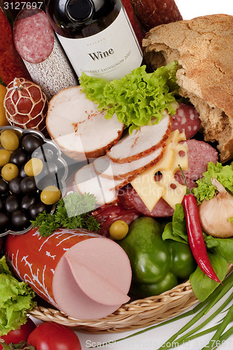 Image of A composition of meat and vegetables with wine