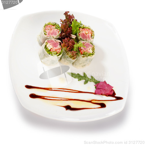 Image of Image of sushi decorated with lettuce. File includes clipping pa