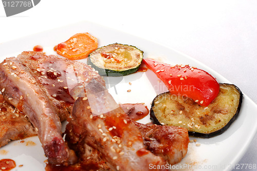 Image of Bone beef platter. Teppan-yaki dish