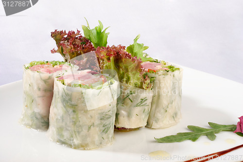 Image of Image of sushi decorated with lettuce