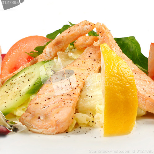 Image of Salmon with vegetables isolated on white