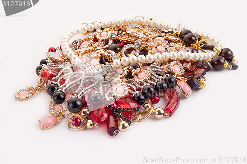 Image of A pile of colored jewellery on white background