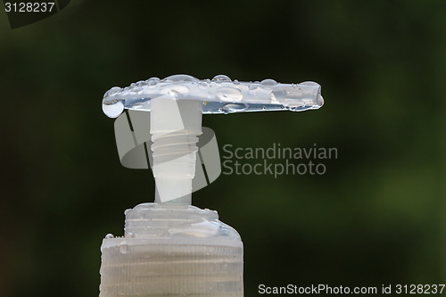 Image of drop water on pump of bottle