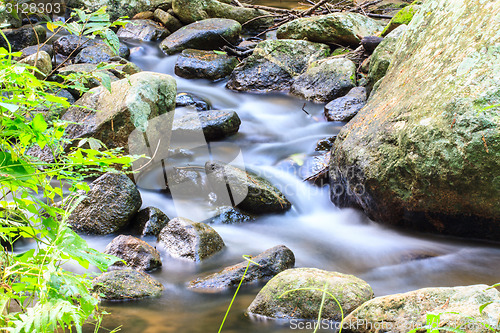 Image of waterfall and rocks covered with moss