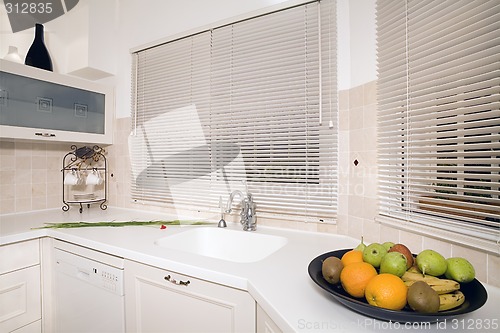 Image of Fruits in the white kitchen