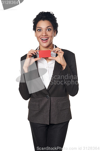 Image of Business woman showing blank credit card