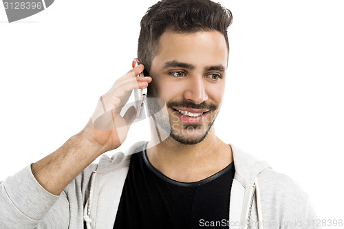 Image of Young man talking on cell phone