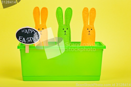 Image of Easter Bunnies in flower pot with chalkboard