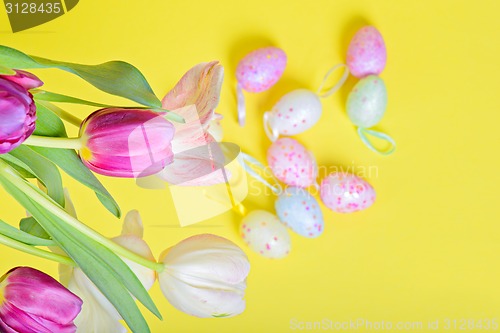 Image of Top view to the easter tulips and eggs