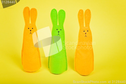 Image of Three easter Bunnys on yellow
