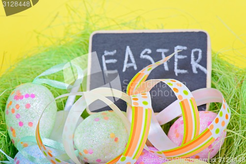 Image of Easter ribbon with eggs and board