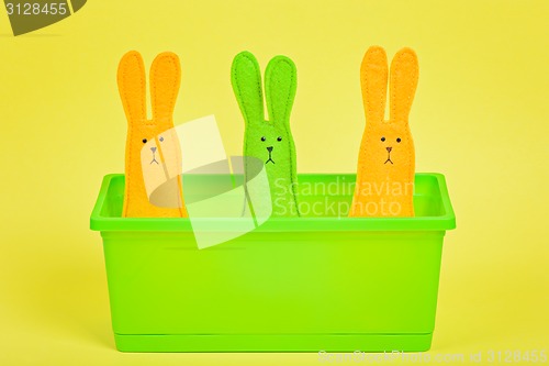 Image of Three easter Bunnies in flower pot 