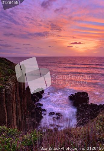 Image of Beautiful sunrise highlights stunning volcanic sea cliffs