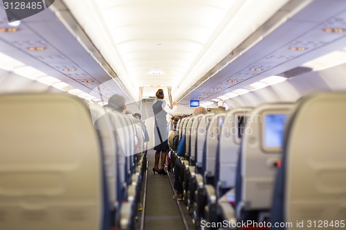 Image of Stewardess on the airplane.