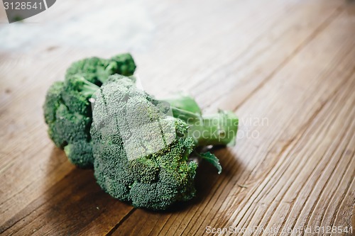 Image of green broccoli on wood table