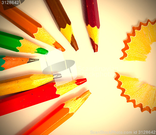 Image of set of a old colored pencils with shavings