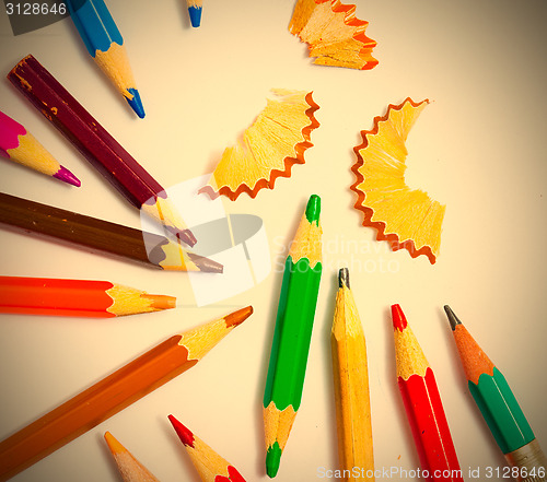 Image of set of a vintage colored pencils with shavings