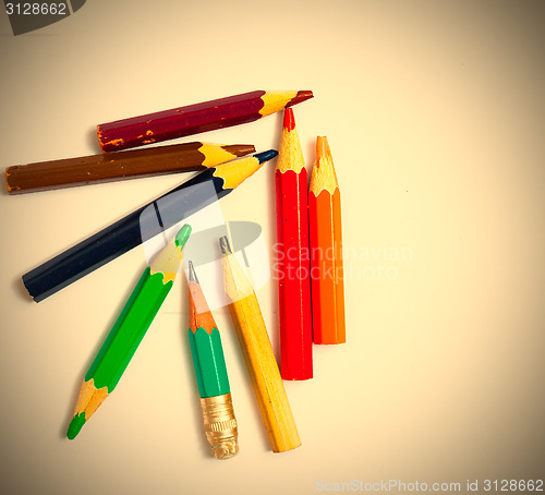 Image of several vintage pencils on a white