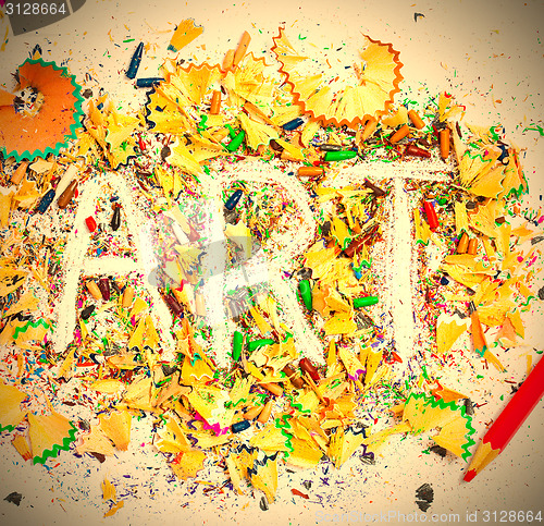 Image of ART word on the background of pencil shavings