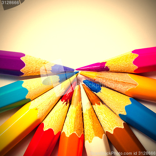 Image of colored pencils on white background