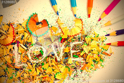 Image of The word LOVE on the background pencil shavings