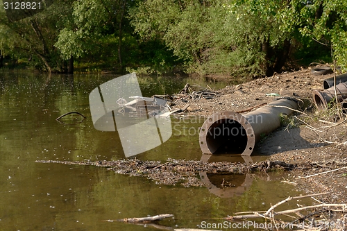 Image of Rusty metal pipes in the forest