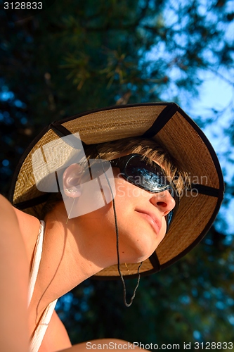 Image of Woman outdoors with nice hat