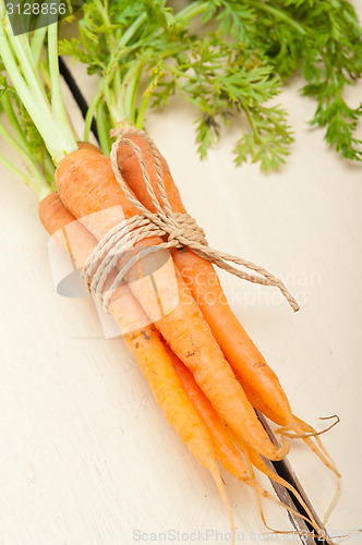 Image of baby carrots bunch tied with rope