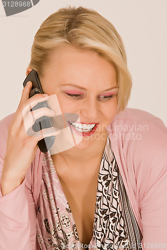 Image of Young woman with mobile phone