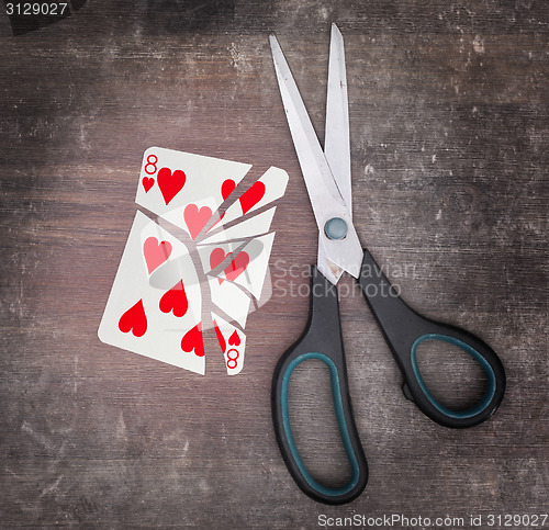 Image of Concept of addiction, card with scissors