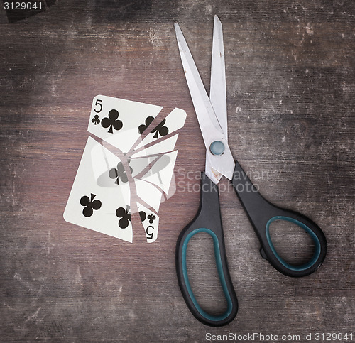 Image of Concept of addiction, card with scissors