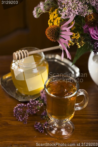 Image of medicinal herbs, honey, herbal tea