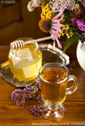 Image of medicinal herbs, honey, herbal tea